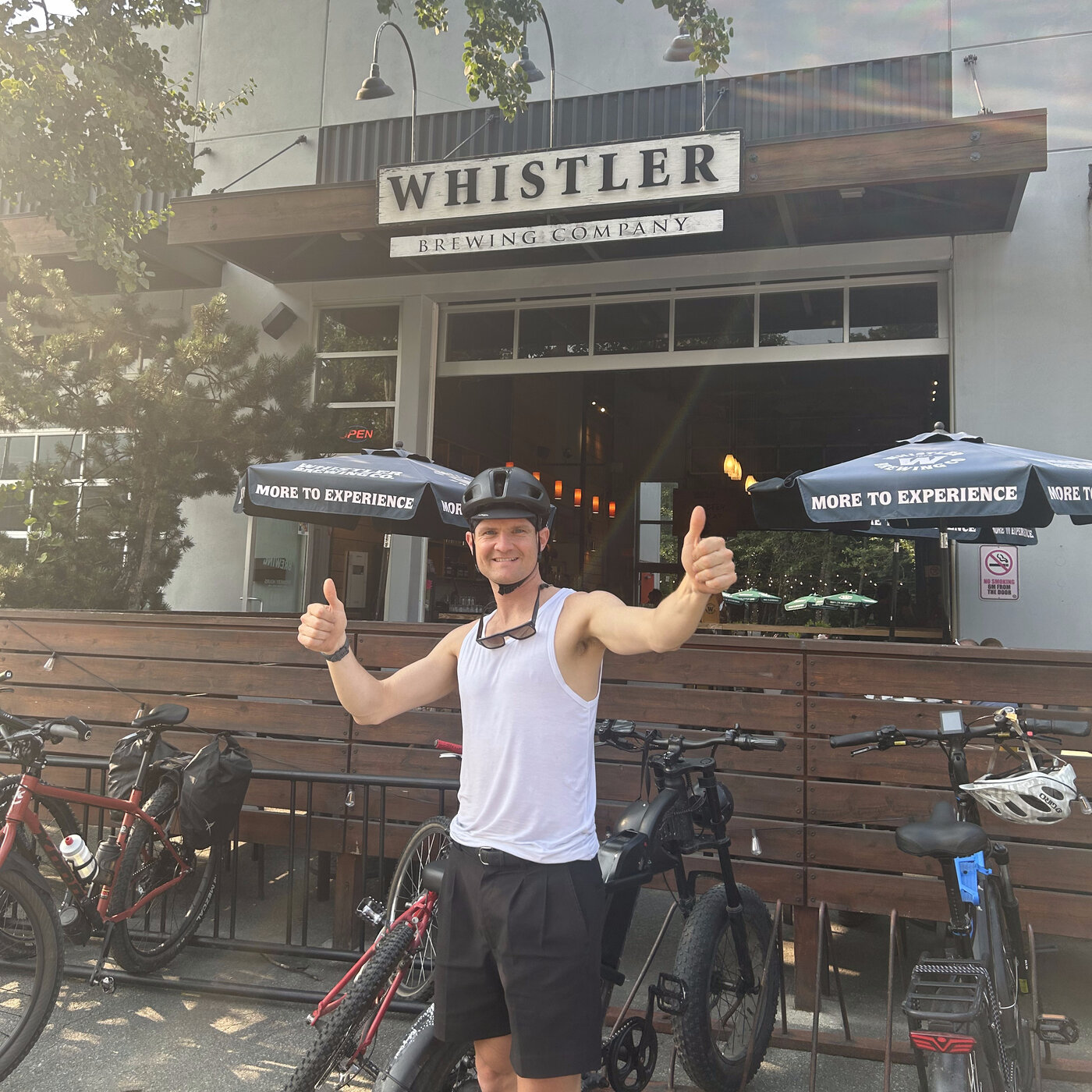 Giving a thumbs up outside Whistler Brewing Company on a Peak Pedal Brews tour