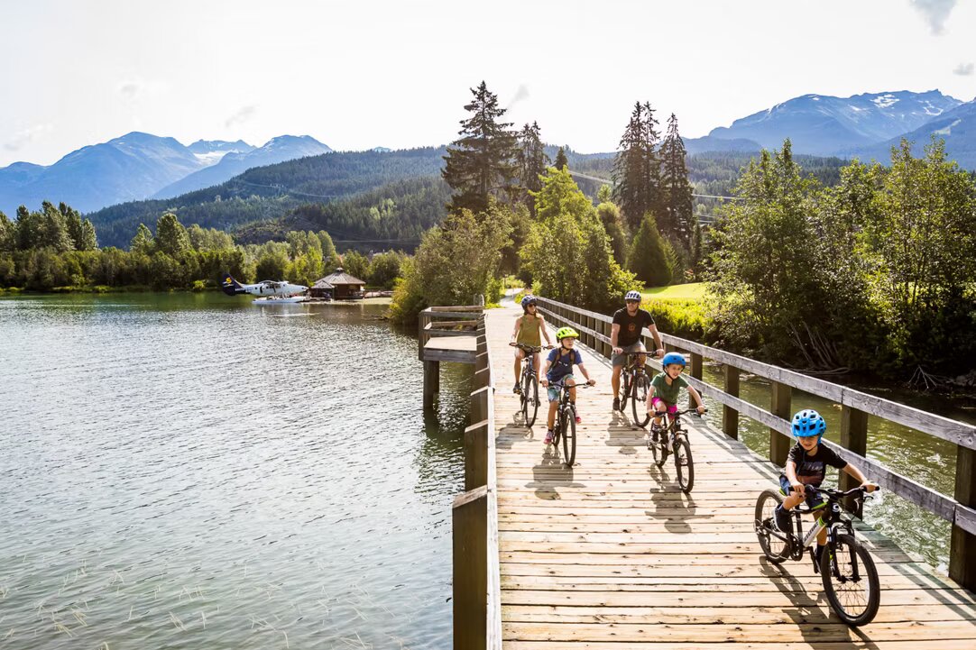 Cyclist on a lakeside path near Whistler