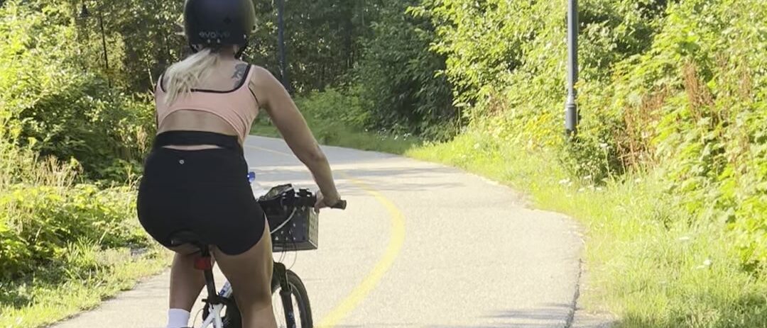 Rider heading down the Valley Trail on a Peak Pedal Brews e-bike