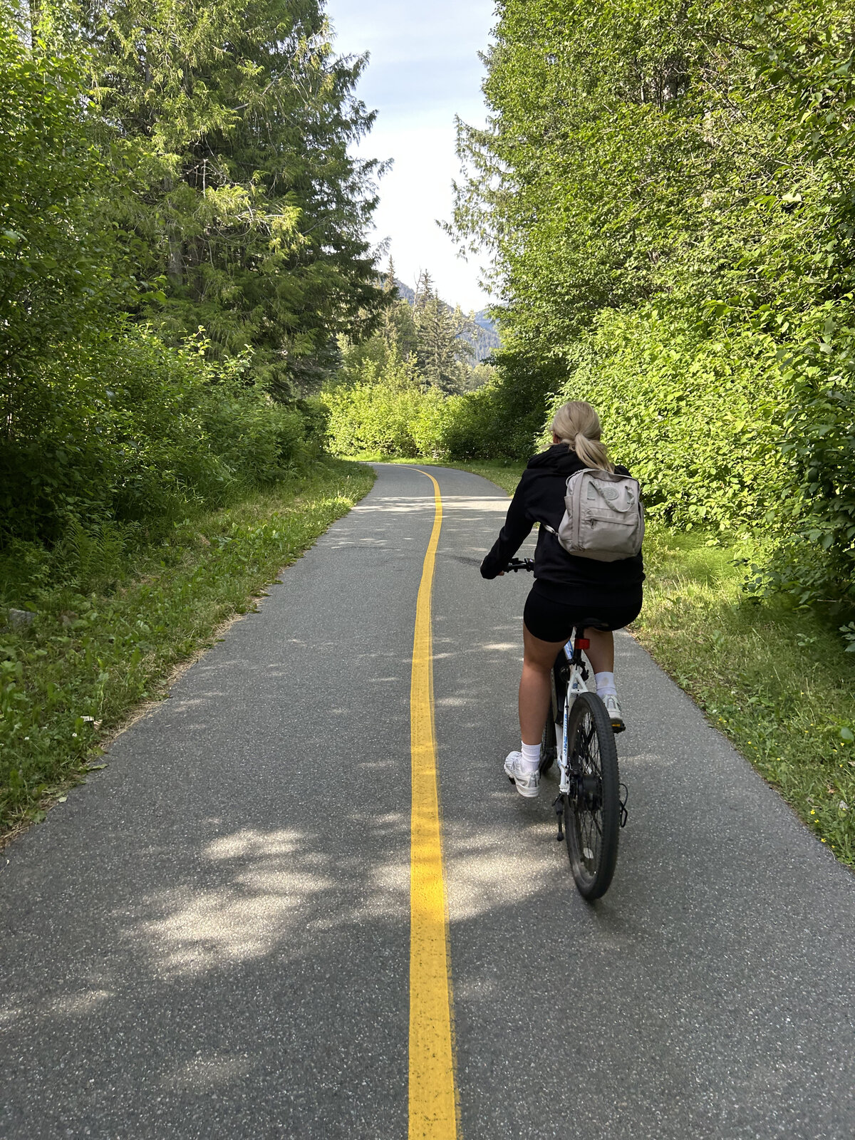Forest trail with mountain views along the Valley Trail